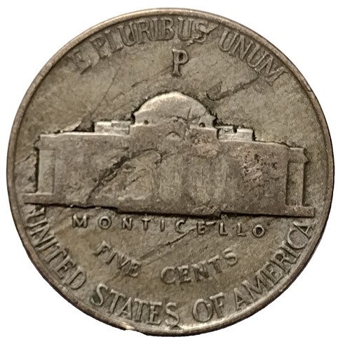 1943 nickel struck on wrong planchet showing distinctive copper color and smaller diameter compared to standard war nickel